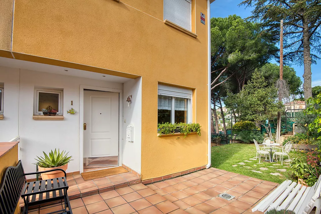 Corner townhouse with a communal pool.