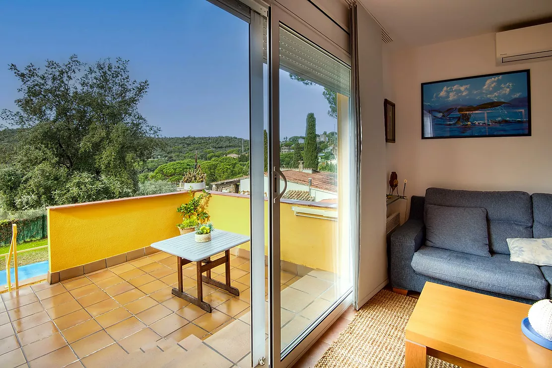 Corner townhouse with a communal pool.