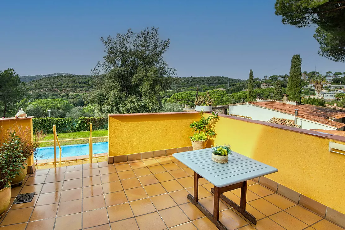 Corner townhouse with a communal pool.